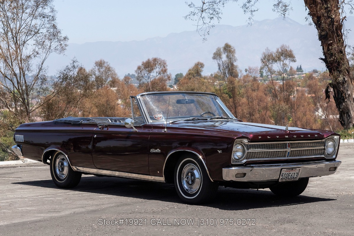 Metallic Dark Burgundy over a black interior. Representing Plymouth?s mid-size performance and luxury
